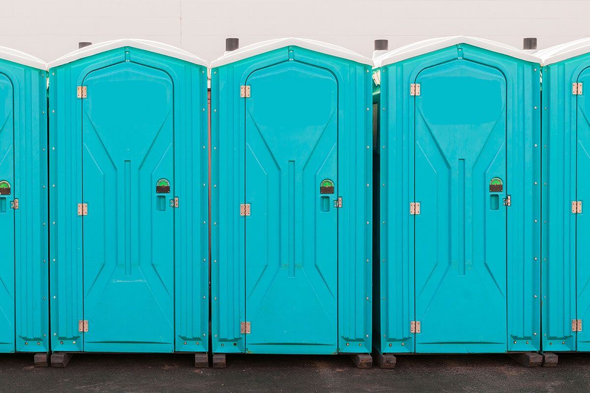 Industrial portable restroom units at a plant in Paris, Texas